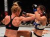 Holly Holm punching Miesha Tate at UFC 196 from UFC Facebook