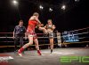 Kim Townsend kicking Michelle Preston at Epic14 by Emanuel Rudnicki Fight Photography