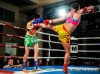 Tali Silbermann kicking Natalie Edwards by W.L. Fight Photography
