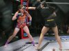 Ashley Medina punching Jillian DeCoursey at Invicta FC 25 by Scott Hirano