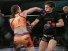 Jillian DeCoursey punching Ashley Medina at Invicta FC 25 by Scott Hirano