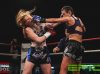 Kerrianne McKay punching Shannon Peek at Epic 17 by Brock Doe Fight Photography