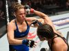 Amanda Nunes punching Ronda Rousey at UFC 207 from UFC Facebook
