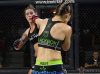 Audrey Wolfe punching Holli Salazar at Invicta FC 31 by Dave Mandel