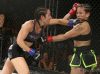 Heather Jo Clark punching Kinberly Novaes at Invicta FC 30 by Dave Mandel