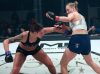 Holli Logan punching Courtney King at Invicta FC 34 by Dave Mandel