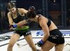 Holli Salazar punching Audrey Wolfe at Invicta FC 31 by Dave Mandel