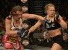 Miesha Tate punching Ronda Rousey at UFC 168 from UFC Facebook