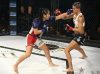 Stephanie Alba punching Alyse Anderson at Invicta FC 30 by Dave Mandel