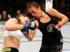Valerie Létourneau punching Elizabeth Phillips at UFC 174 from UFC Facebook